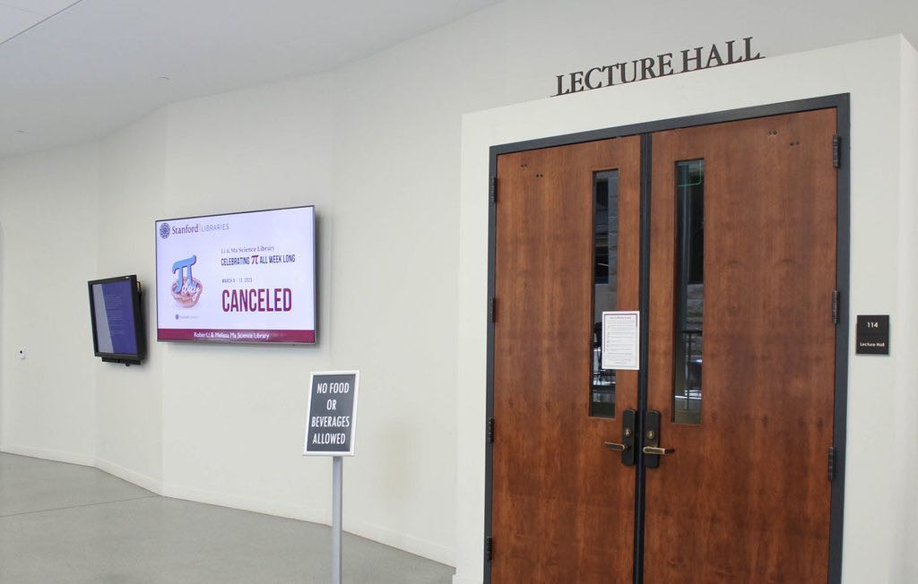 Closed doors to a lecture hall on campus