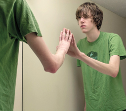 Boy confronting mirror