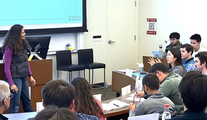 GSB Lecturer Monisha Perkash facilitates a classroom discussion with students in Ecopreneurship Foundations.